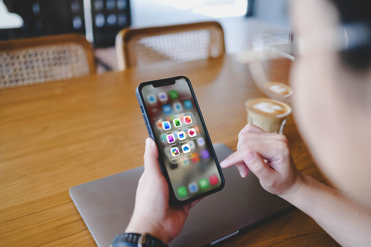 Bangkok, Thailand. January 18, 2026; A person holding a smartphone horizontally, showing a folder of Microsoft 365 applications including Word, Excel, and M365 Copilot.