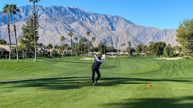 Woman Golfer Teeing Off on Palm Springs Golf Course