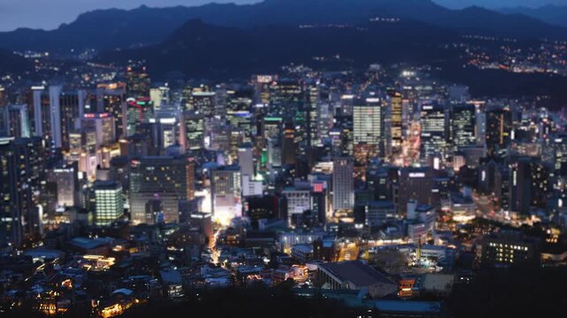 Seoul skyline, South Korea, beautiful vibrant spring aerial sunset view, with mountains and scenery beyond the city, seen from observation deck of Namsan Park, Gyeonggi-do province, Republic of Korea