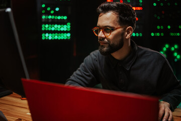 It specialist working on computer in data center