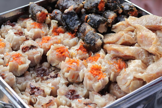 Assorted Indonesian Street Food Display, Siomay, Dumplings, and Rolls, showcasing culinary diversity and traditional flavors for local cuisine promotion