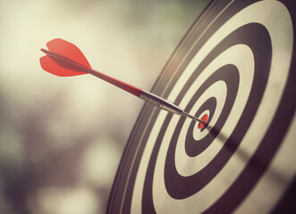 Dart Arrow Hitting the Absolute Center Bullseye of a Dartboard. Concept for perfect precision, strategic business goals, and competitive sports success in 2026.
