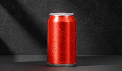 A red aluminum soda can with water droplets clinging to it, placed in a dark room with light and shadow effects