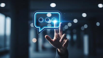 hand interacting hand touching blue glowing chat icon in dark room with blurred background and lights