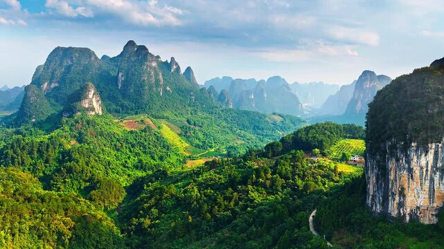 Aerial shot of spectacular karst mountain peak and green forest natural landscape in Guilin, China. 