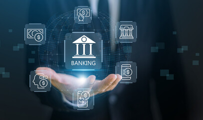 Businessman hand holding virtual banking holographic interface with financial icons, global finance technology, digital economy and fintech investment concept, future of money and cashless society