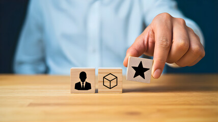Hand placing a star rating block, symbolizing excellent customer service, product quality, and top-tier user experience on a wooden table