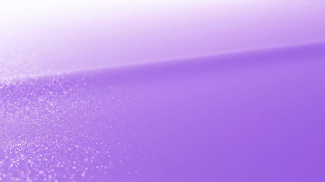 Close-up of a purple and white gradient background with a glittery texture and a shallow depth of field.