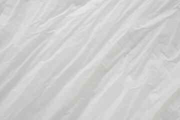 Obraz premium Crumpled White Plastic Sheet Surface Texture Background