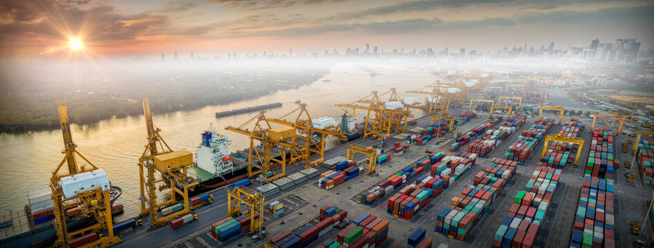 Logistics and transportation of Container Cargo ship and Cargo plane with working crane bridge in shipyard at sunrise, logistic import export and transport industry background