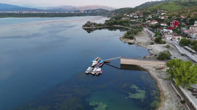 stunning 4k drone footage of shkoder lake in albania capturing serene waters surrounding mountains and timeless history watch the history
