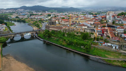 Obraz premium Aerial panorama view of the downtown in the city Barcelos in portugal on a cloudy spring noon. 