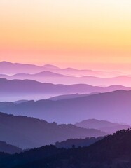 Obraz premium Serene Mountain Range at Sunset - A Majestic Landscape of Purple Hues and Golden Skies.
