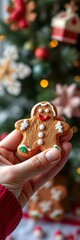 Hand holding a decorated gingerbread cookie with festive icing details,  baking,  icing