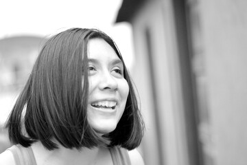 Happy teenager girl laughing out aloud.