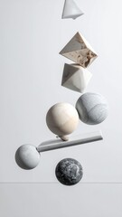 Floating assortment of geometric shapes and spheres against a clean background