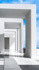 White geometric architecture with clear sky and ocean view
