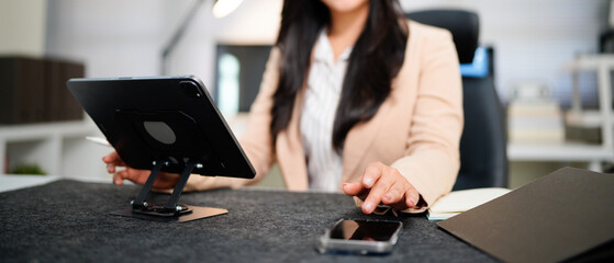 Closeup businesswoman with phone, digital app and cloud computing, working late with website connection
