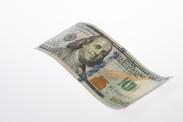 Money in 100 dollar bills on paper. Money in 100 USD dollar banknotes. Money in hundred dollar on white isolated background. Money in USA dollar banknote.