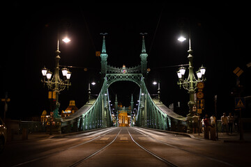 Obraz premium Liberty Bridge at night over the Danube River, Budapest, Hungary