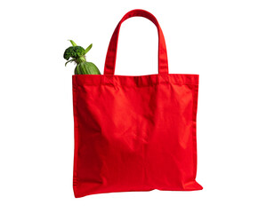 Bright red tote bag holding green produce, set against a solid black background