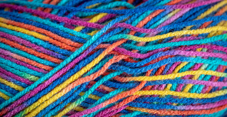 Close up of colorful knitting yarn. Colorful wool texture. Close up of colorful fabric.