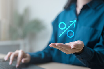 Interest rate growth concept showing percentage symbol with upward arrow above hand, representing savings comparison, deposit yield, annual percentage yield, investment income, and banking decisions.