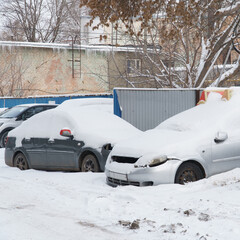 Cars covered with snow in Parking lot