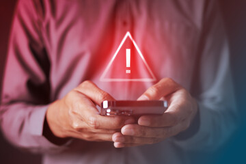 Cybersecurity alert concept with warning symbol on smartphone, representing firewall protection, network defense, system threat detection, and digital security risk management.