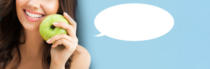 Portrait of white brightly teeth smile happy woman hold hand apple fruit, isolate blue background....