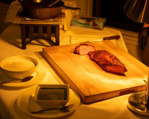 cooked steak on a board 