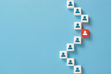 Business concept image of dice with people icons over blue background, human resources and management concept