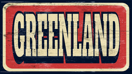 Aged and worn Greenland sign on wood