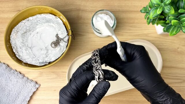 The process of caring for silver jewelry at home. The concept of caring for things, neatness, cleanliness, and daily routine.