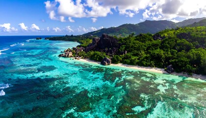 Aerial view of a tropical coastline with clear turquoise waters
