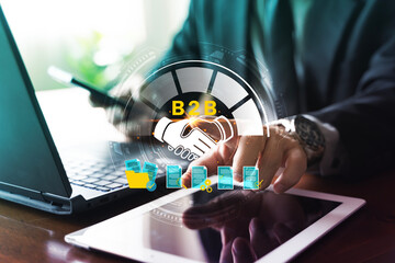 B2B Partnership Agreement Concept with Handshake Icon on Laptop and Tablet