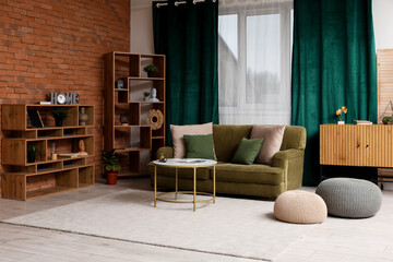 Obraz premium Stylish interior of living room with sofa near brick wall