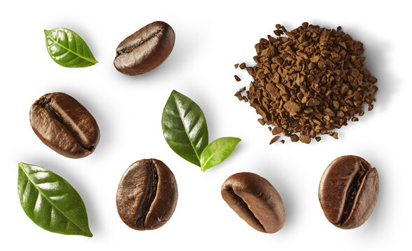 Set of roasted coffee beans, fresh green leaves and instant coffee powder pile isolated on white background. Top view collection. Soluble and grain caffeine ingredients.