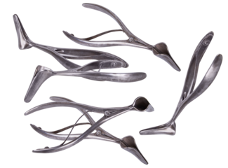 collection of various gynecological speculum instruments arranged artistically on a dark background.