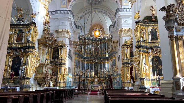 Belarus, September 5, 2024: St. Francis Xavier Cathedral in Grodno. Small Basilica. The main altar is decorated with columns, sculptures, and gold-plated carvings. 4К