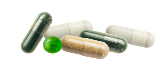 A range of capsules and dietary supplements, including green spirulina capsules, beige powder-containing capsules, and opaque white capsules on a transparent background.
