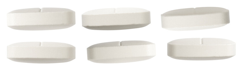 set of six white oval-shaped tablets, each with a visible score line, neatly arranged on a...