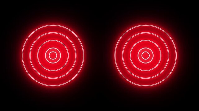 Two glowing red concentric circles with a central dot on a black background abstract bright