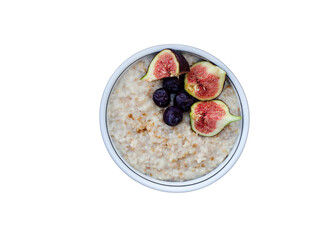 Bowl of oatmeal with blueberries and figs