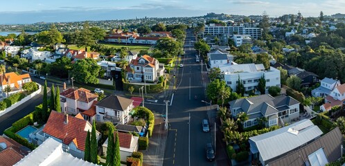 Aerial view of a residential street in Parnell, Auckland, New Zealand. The photo shows houses, trees, and cars on the road. The image captures the urban landscape of Auckland. © Stefan