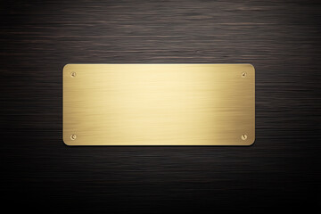 Gold metal nameplate with screws on wooden background