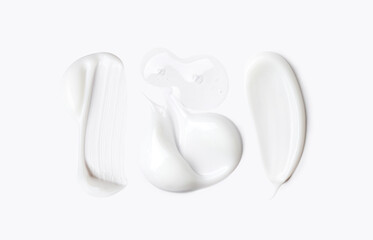 samples of cosmetic care products on a light background