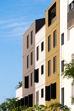 Modern minimal architecture apartment facade with windows in Montpellier creating geometric residential clean lines beneath open sky
