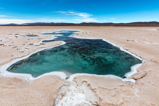 Salt lake Ojos de Agua in Salinas Grandes high-altitude desert Argentina