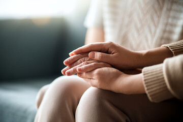 daughter comforting old mom